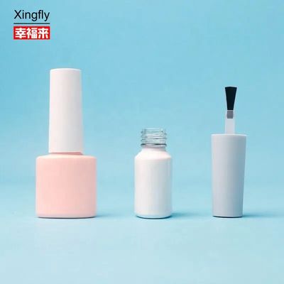 Recipiente de esmalte de unhas de vidro vazio com manuseio de superfície de revestimento